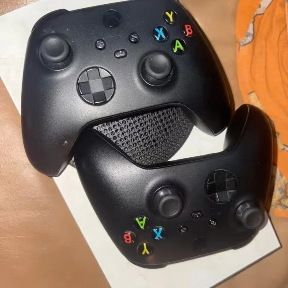 Black Gaming Controllers with Colorful Buttons